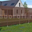 Забор из металлического штакетника коричневый (RAL 8017)